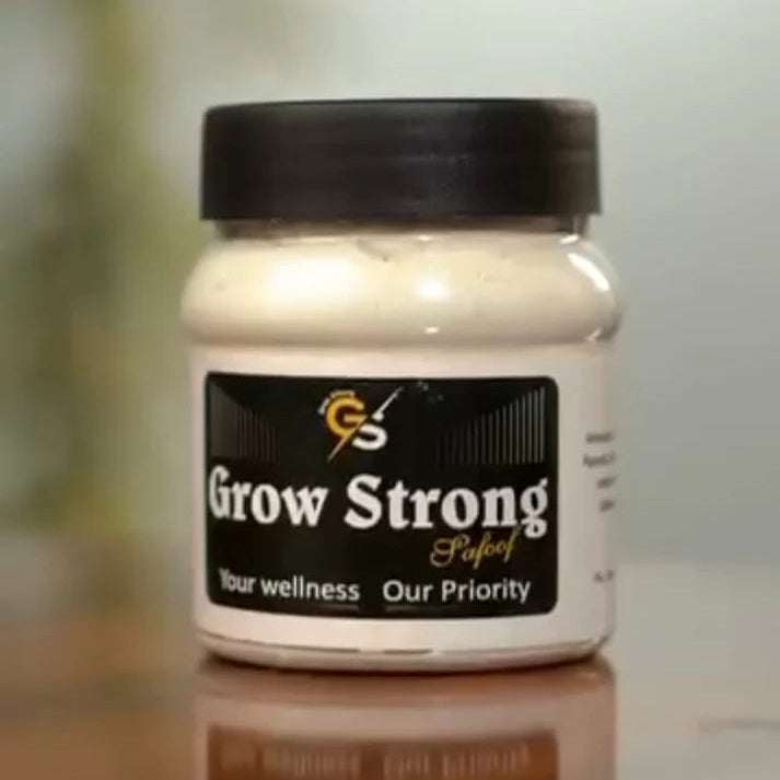 Jar labeled 'Grow Strong' on a reflective surface with a blurred background